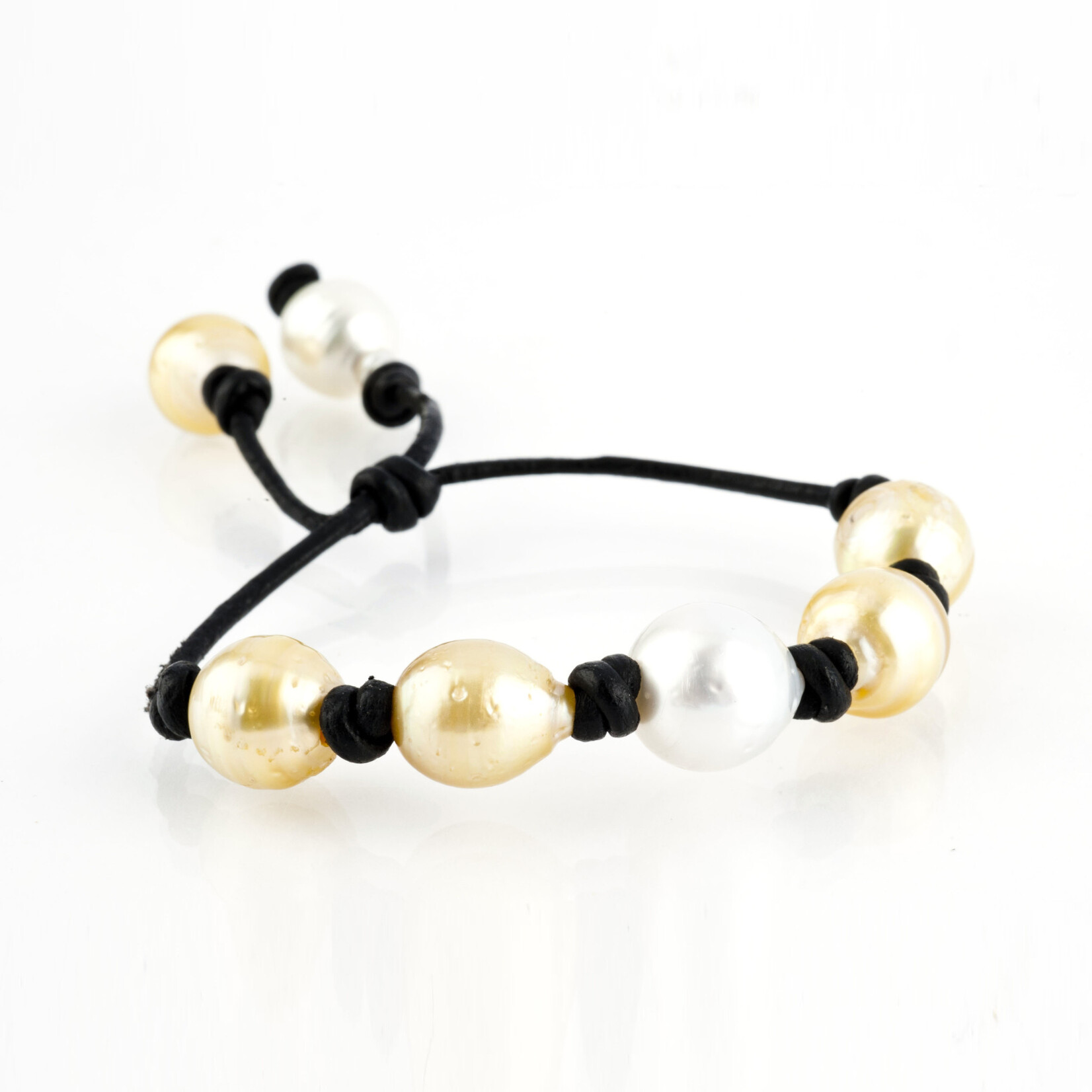 Mina Danielle Yellow and White South Sea and Tahitian Pearl Bracelet on Black Leather Cord with adjustable sliding closure.
