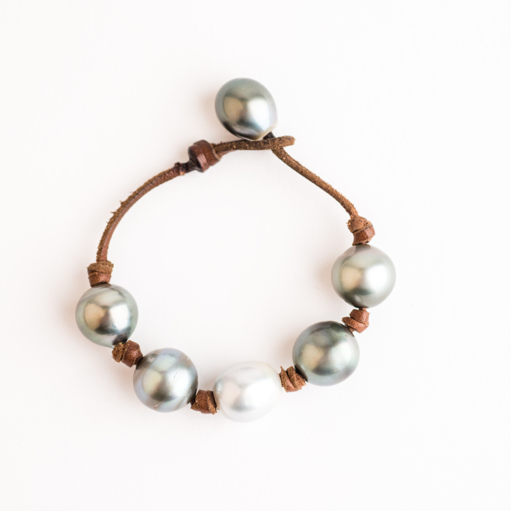 Mina Danielle Light Gray Tahitian and White South Sea Pearls knotted on Natural Leather Cord. Pearl Button Closure.