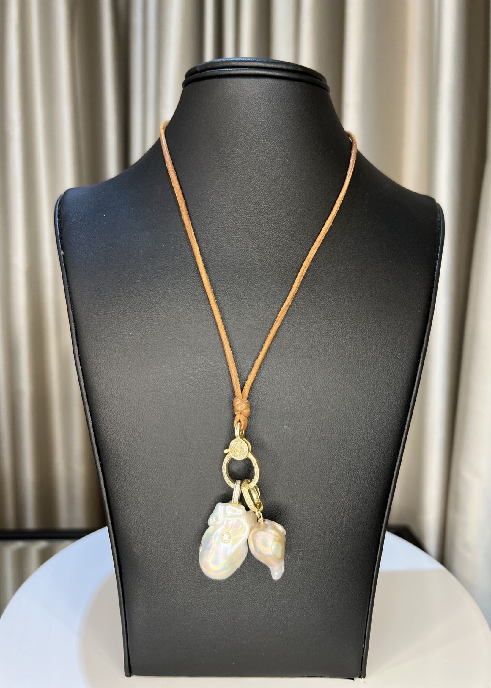 Mina Danielle White Baroque Pearl with Diamonds and Gray Baroque Pearl hang from a Gold Diamond Lobster clasp. Neckalce is finisehd off with a Pearl button Closure. Light brown leather cord.