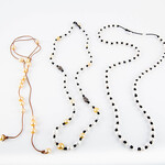 Mina Danielle Long Large white Pearls knotted on black leather cord.