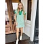 The Uptown Peach Zoe’s Green Zip-Up Mini Dress