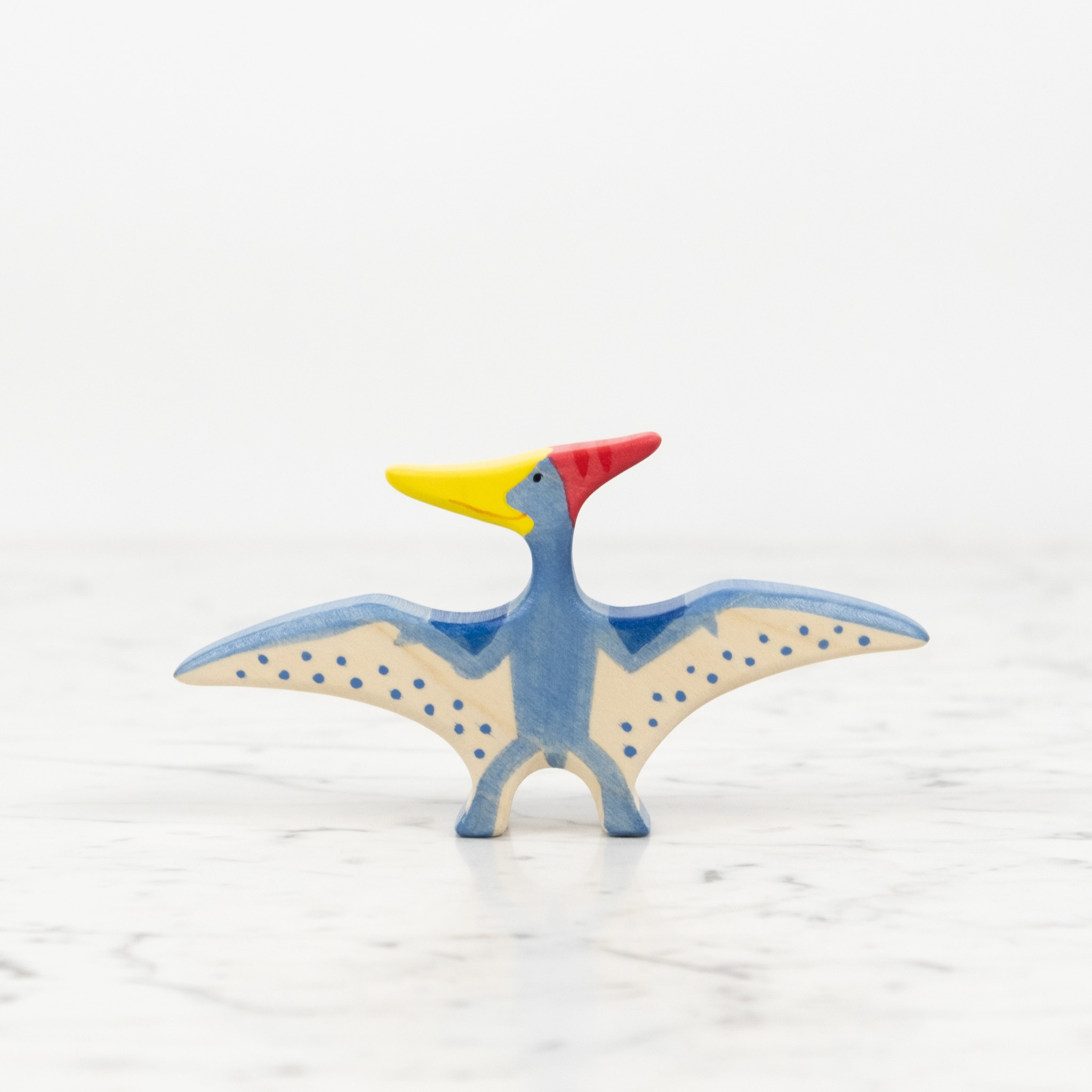 Holztiger Flying Blue Pteranodon Dinosaur with Red Crest and Yellow Beak