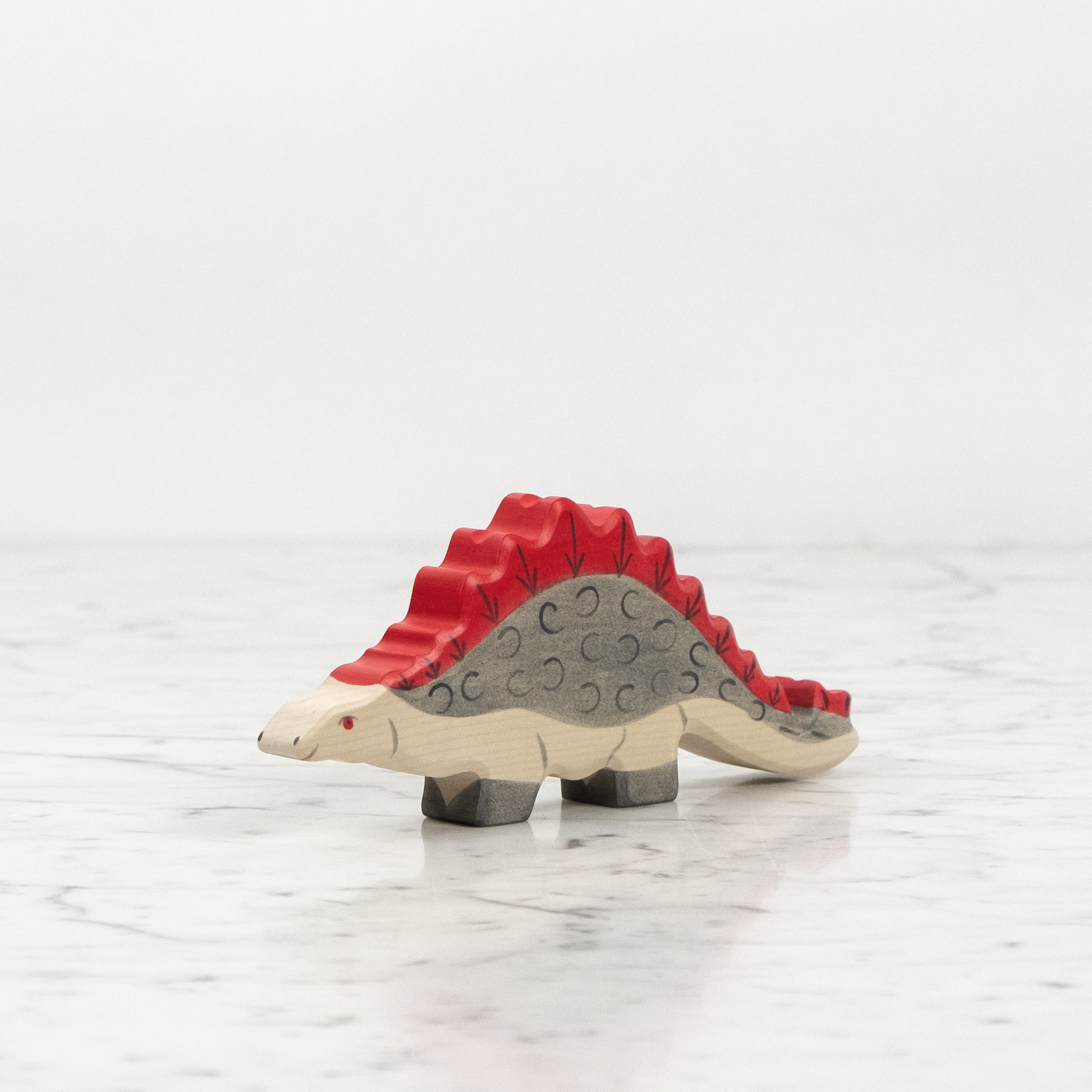 Grey Stegosaurus Dinosaur with Red Spines