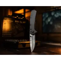 Buck Range Elite with a black and aluminum handle and a CPM Magnacut blade