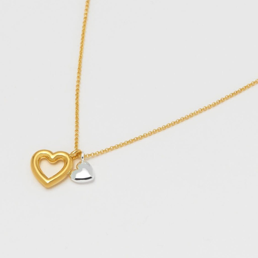 ESTELLA BARTLETT DOUBLE HEART CHARM NECKLACE - YELLOW GOLD AND SILVER