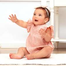 TRUFFLES RUFFLES DAPHNE PINK SWISS DOT FLUTTER SLEEVE BODYSUIT