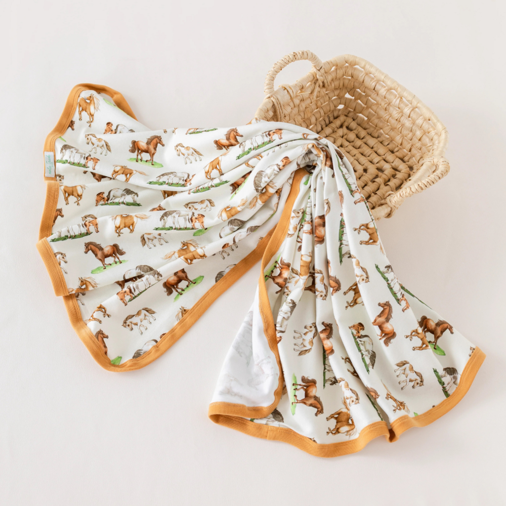 NOLA TAWK SADDLE UP ORGANIC COTTON SWADDLE