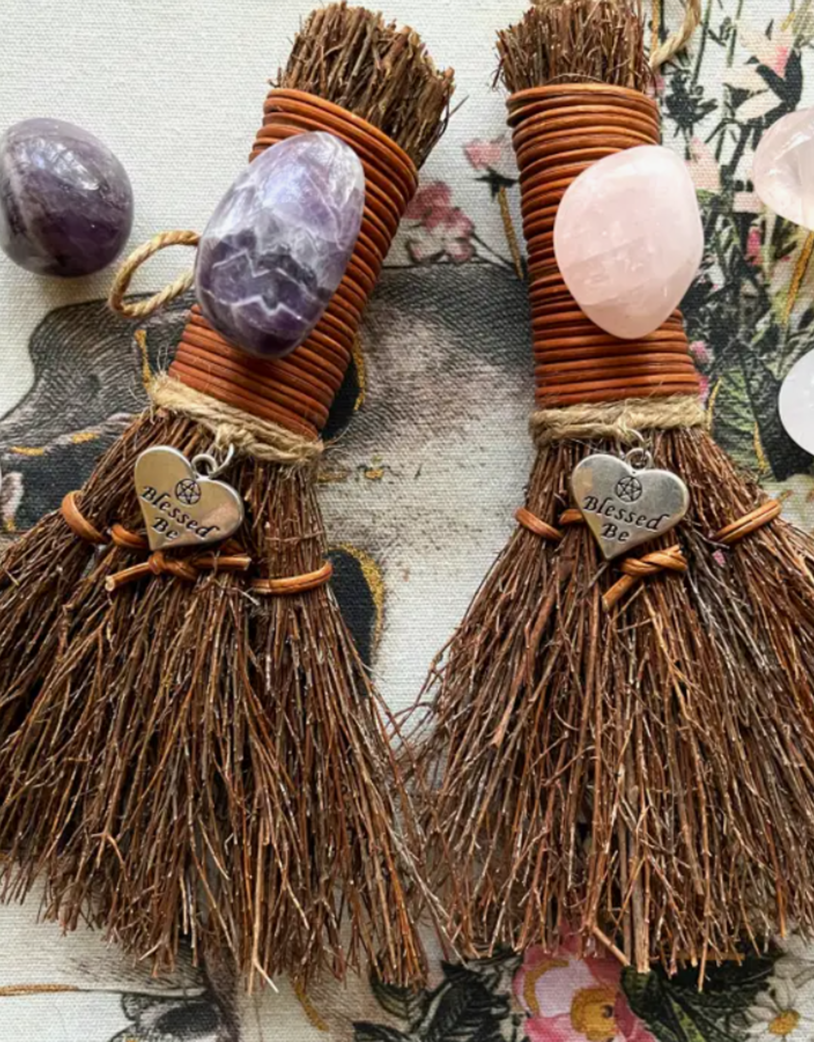 https://cdn.shoplightspeed.com/shops/626075/files/55717558/1600x2048x1/blessed-be-witchs-besom-witch-broom-w-crystal-rose.jpg
