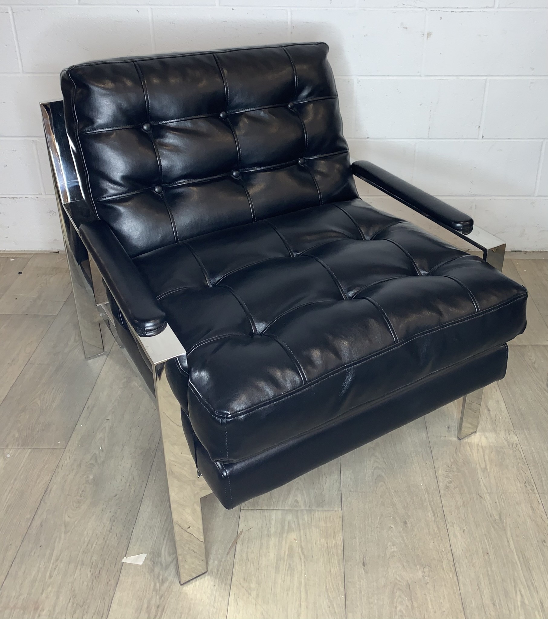 Contemporary Black Leather Chair with Buttons and Chrome Accents