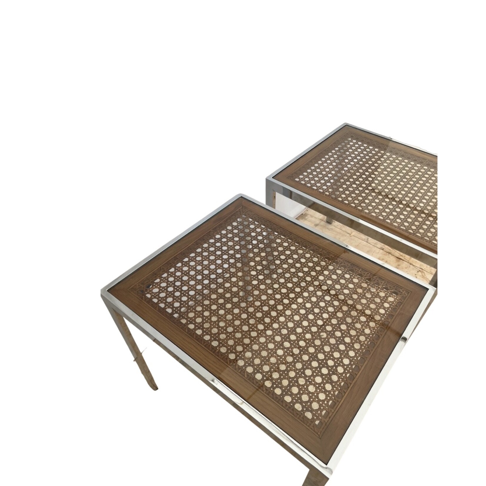 Pair of Mid-Century Modern chrome tables with woven cane under glass by Milo Baughman, versatile as side or cocktail tables with striking chrome and cane contrast.