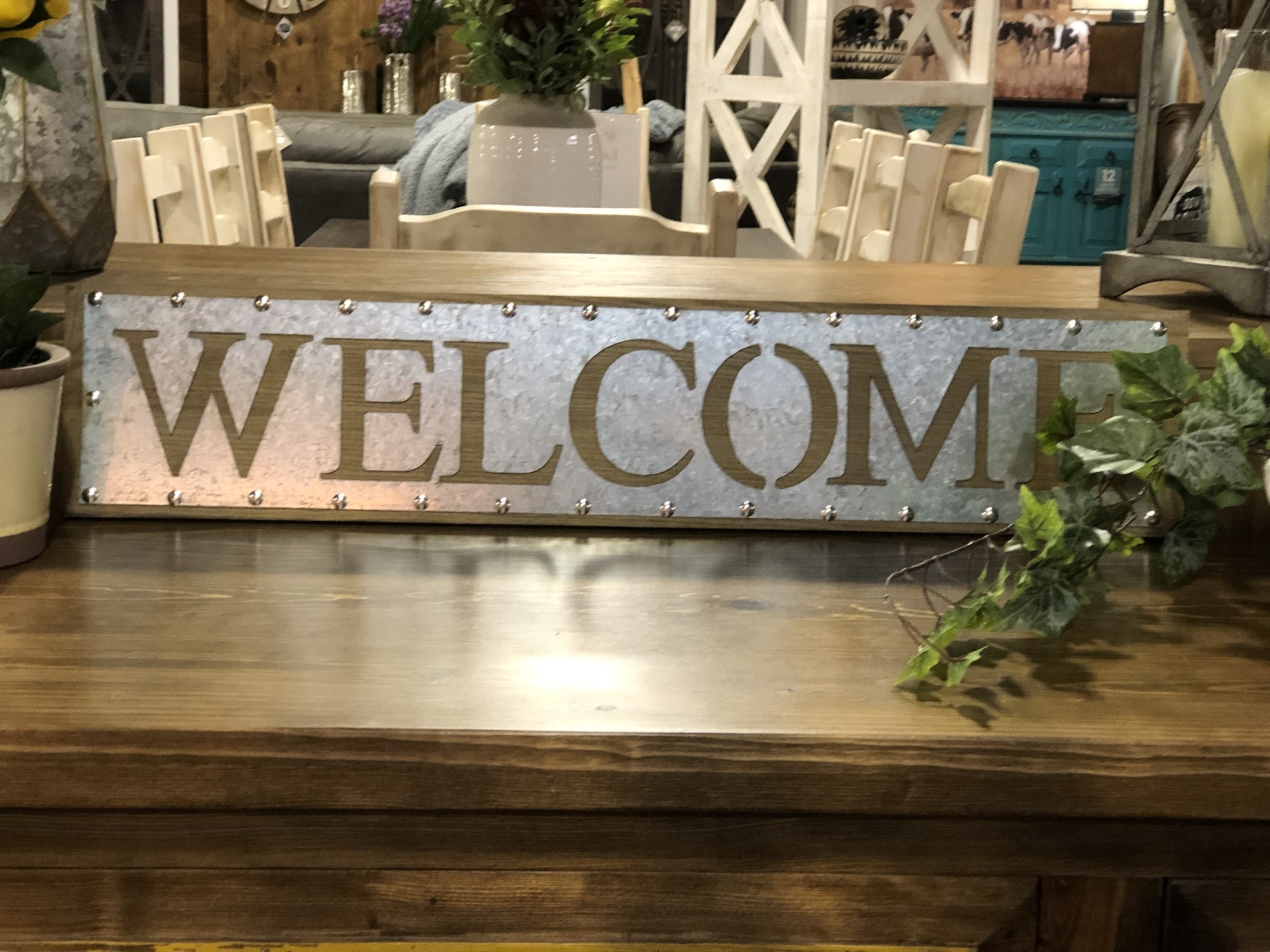 Welcome metal and wood sign