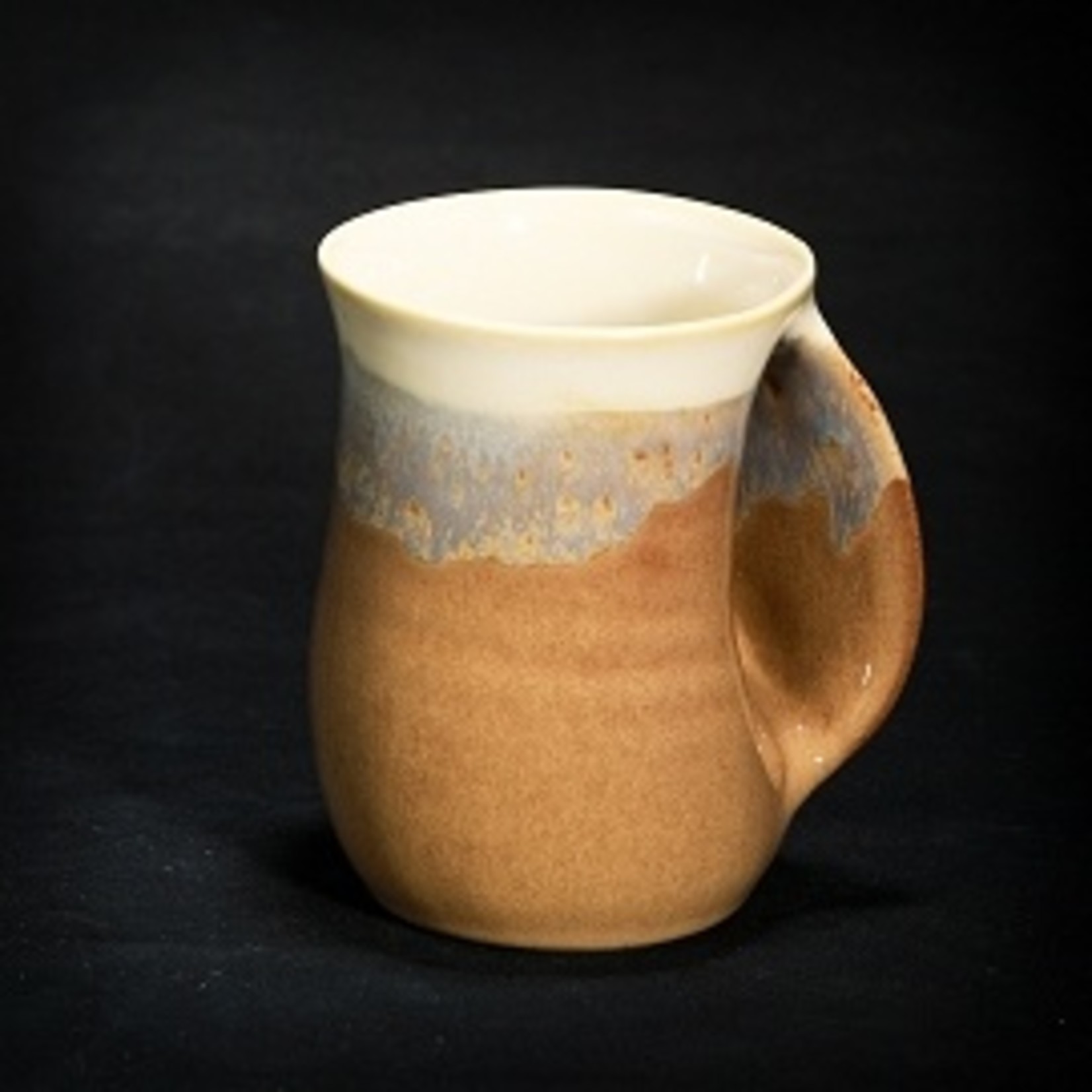 https://cdn.shoplightspeed.com/shops/628065/files/14339913/1652x1652x1/clay-in-motion-handwarmer-mug-right-14-oz-clay.jpg