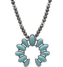 Blandice Crescent shaped turquoise pendant on beaded necklace