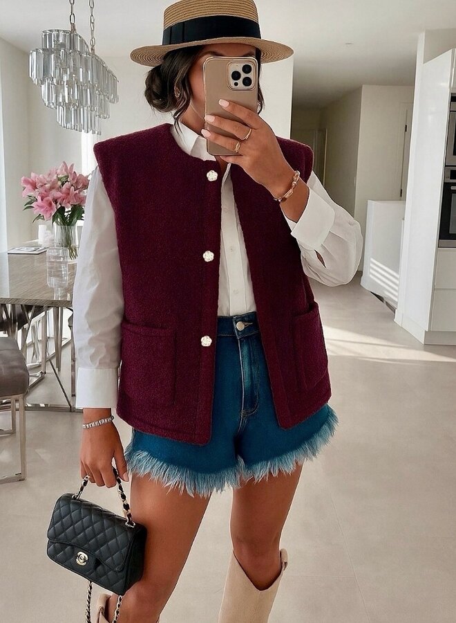 Sleeveless vest with gold buttons