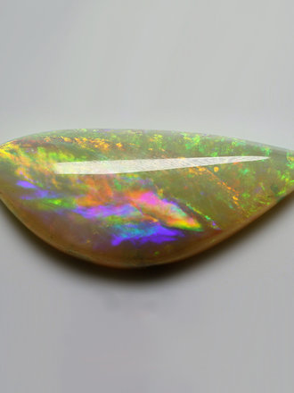 4.11ct freeshape Green & Orange Mintabie White Opal Cabochon