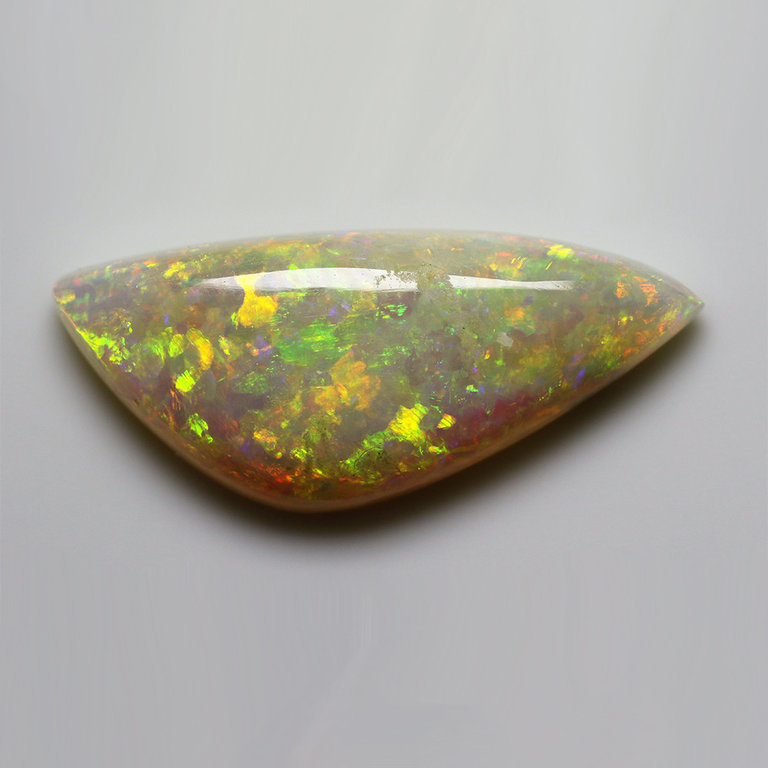 3.52ct freeshape Green & Orange Mintabie White Opal Cabochon