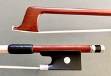 Pernambuco 3/4 violin bow, unbranded, with silver-mounted ebony frog