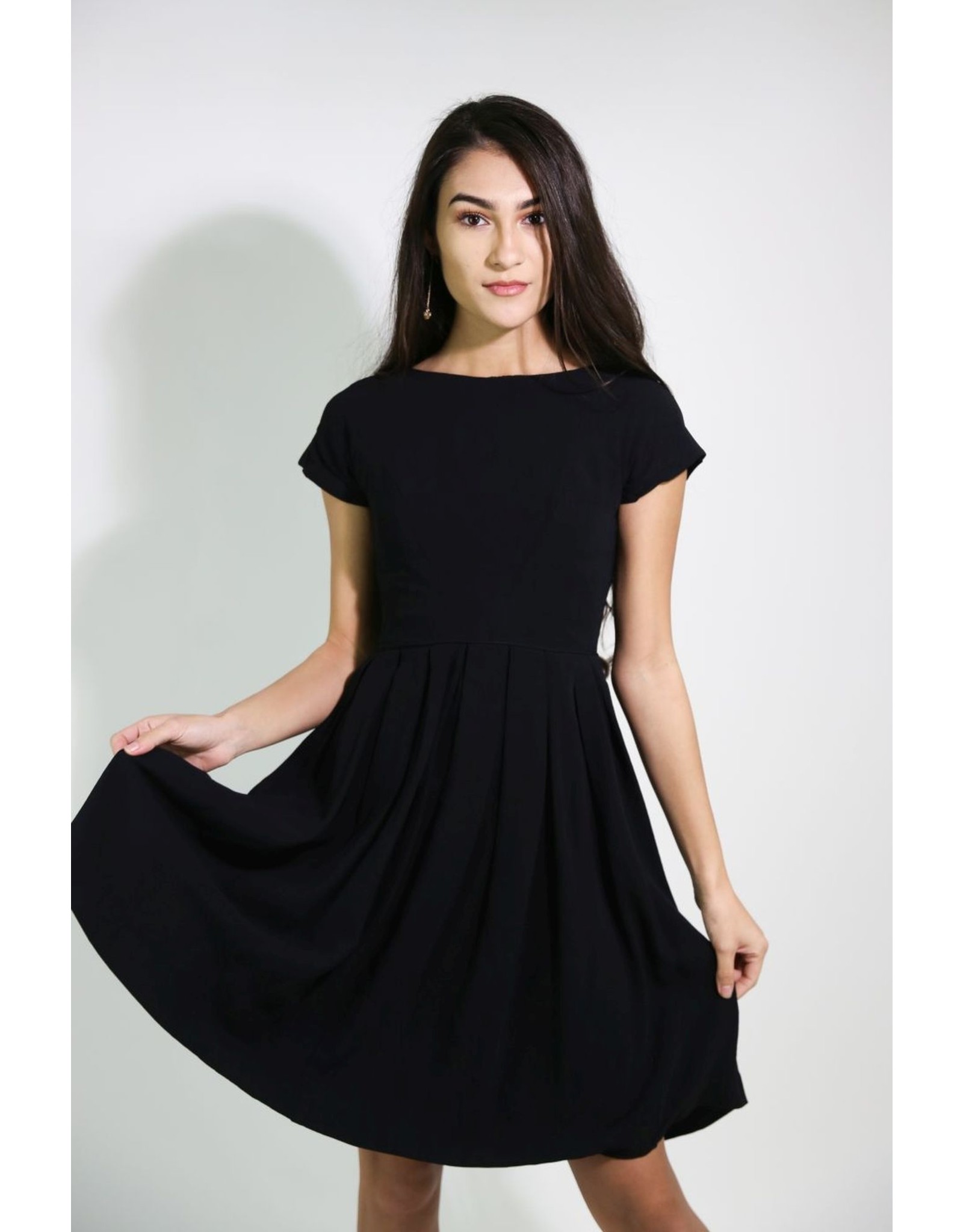 black dress with pleated skirt