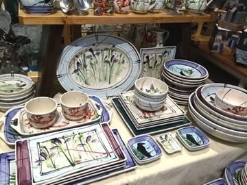 a selection of donna toohey pottery with a wild iris pattern