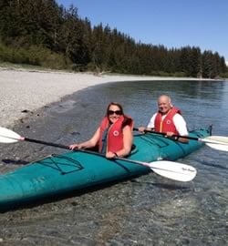 Alaska Beachcombers owners in a kayak