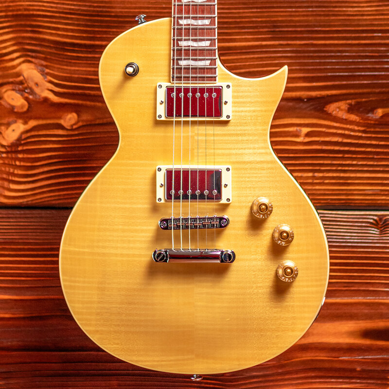 ESP/LTD Elevate your playing with the LTD EC-256FM, a standout from the 200 Series that delivers exceptional value and superior craftsmanship far beyond its price point. This set-neck beauty boasts a resonant mahogany body topped with eye-catching flamed maple, f