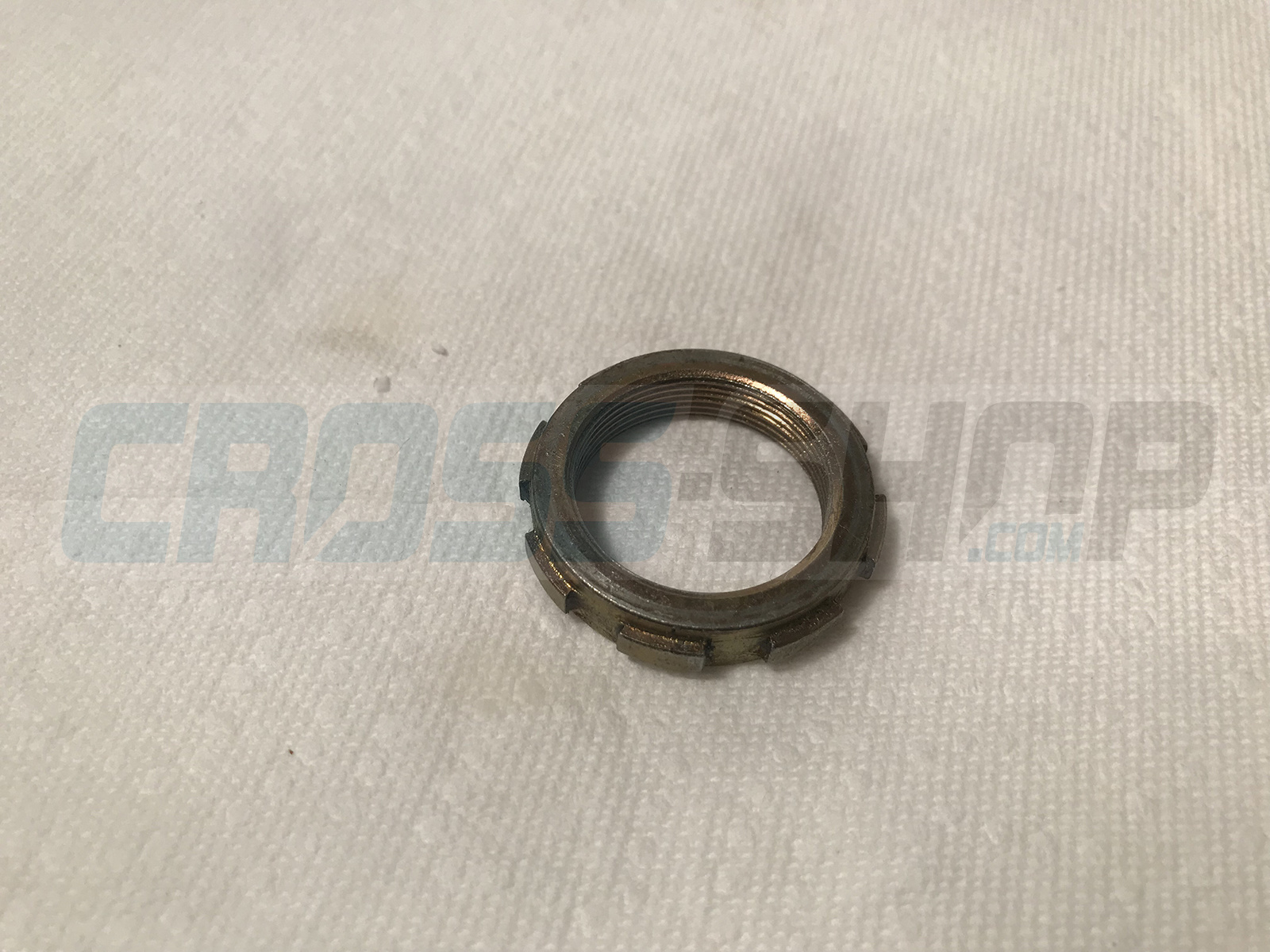 NUT STEERING BEARING 85J 13->