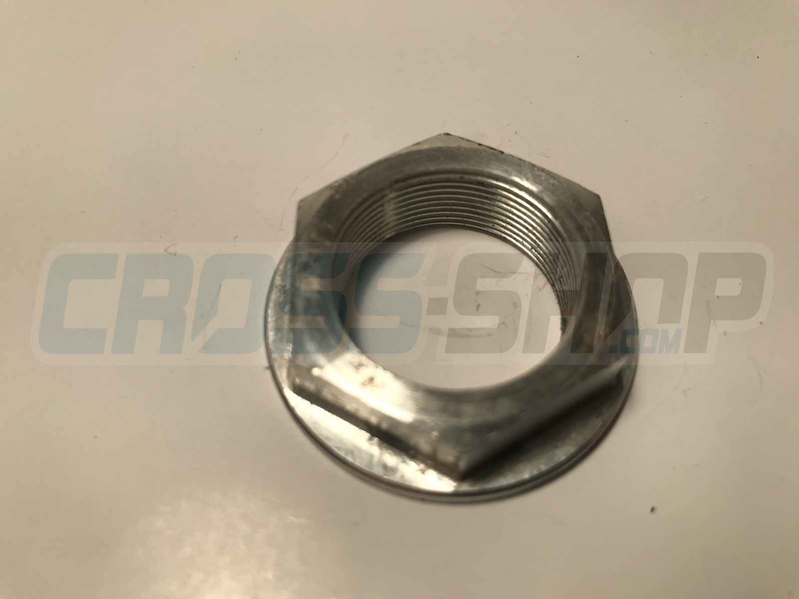 NUT STEERING STEM ALUM 98/->
