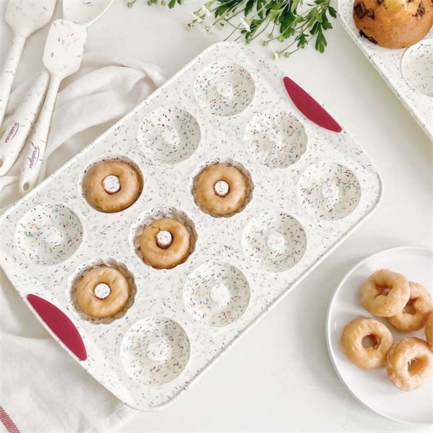 https://cdn.shoplightspeed.com/shops/630188/files/44878500/1500x4000x3/trudeau-confetti-silicone-donut-pan-12-donuts.jpg