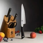 Shun Sora 6 Pc Basic Block Set: Paring 3.5", Utility 6", Chef's 8", Combination Honing Steel 9", Herb Shears and 13-Slot Bamboo Block.