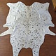 White cow hide with acid wash spots