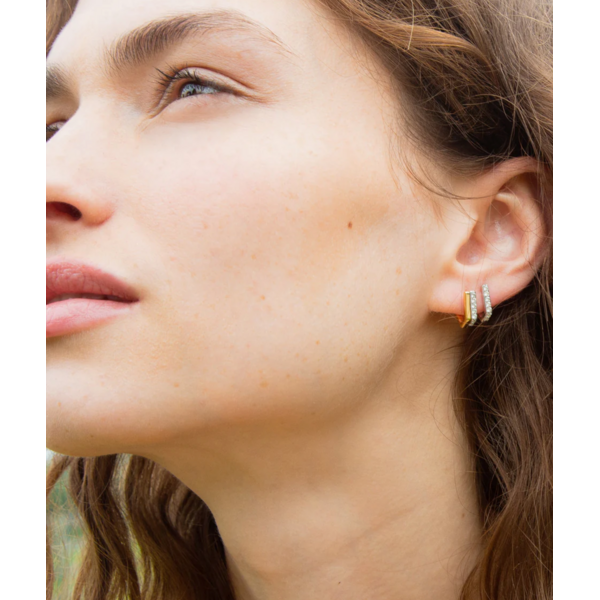 MONICA RICH KOSANN Two-Tone Infinity Huggie Earrings with White Sapphires in Sterling Silver and 18K Yellow Gold