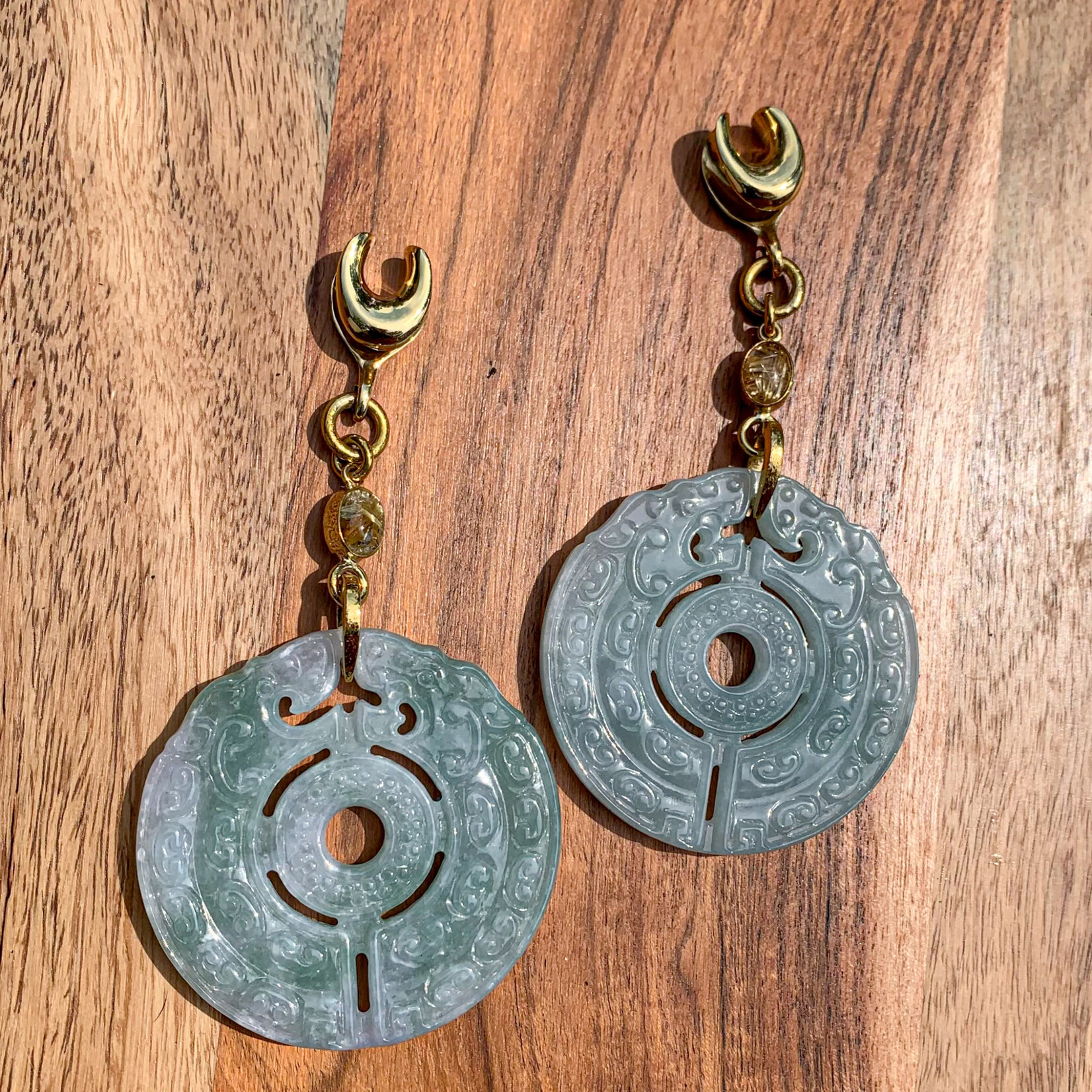 Diablo Organics Diablo Organics "Archaic Jade" carved jade disk on 1/2 brass saddle spreader with rutilated quartz accent