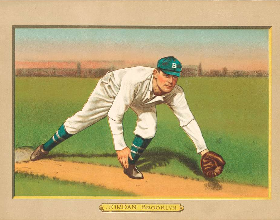 Portrait du joueur de baseball Tim Jordan des Brooklyn Dodgers s’apprêtant à attrapper une balle au sol