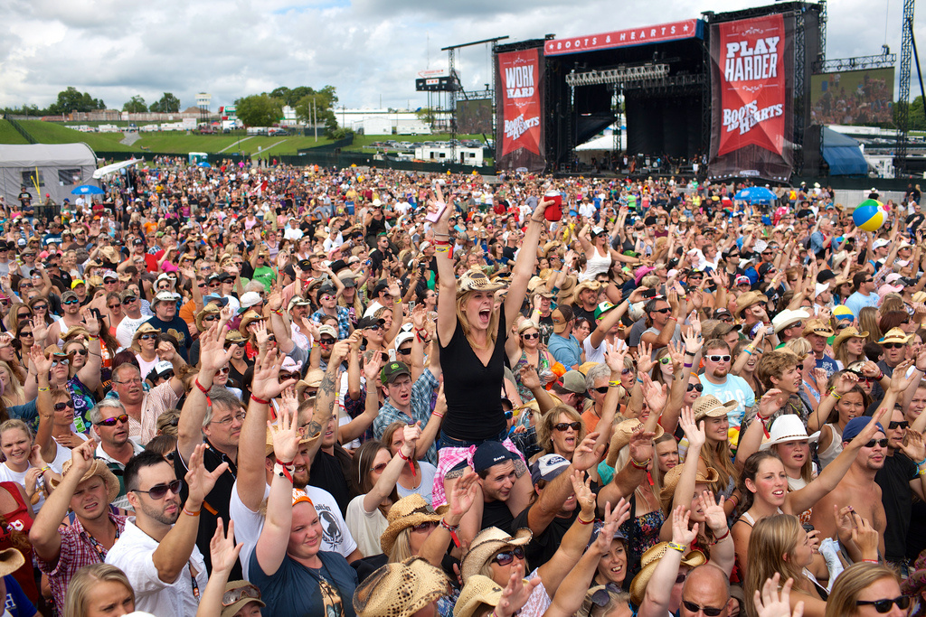 Woman in crowd wearing cowboy hat