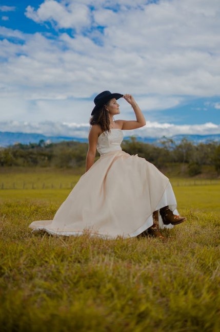 Bride wearing cowboy hat and leather boots