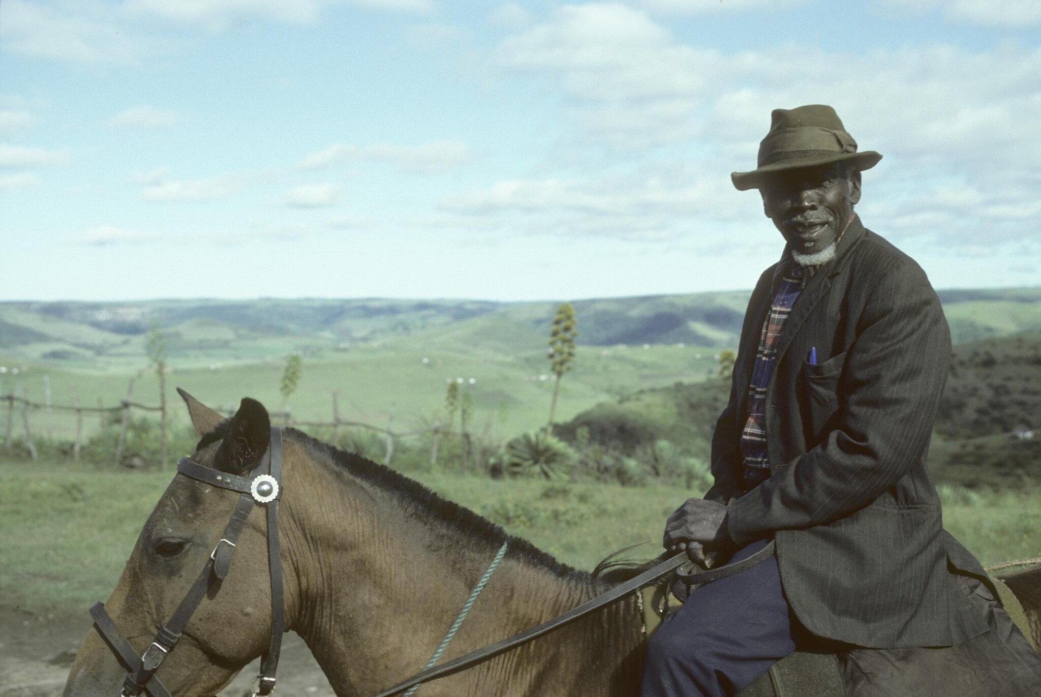 Rider wearing a trilby hat