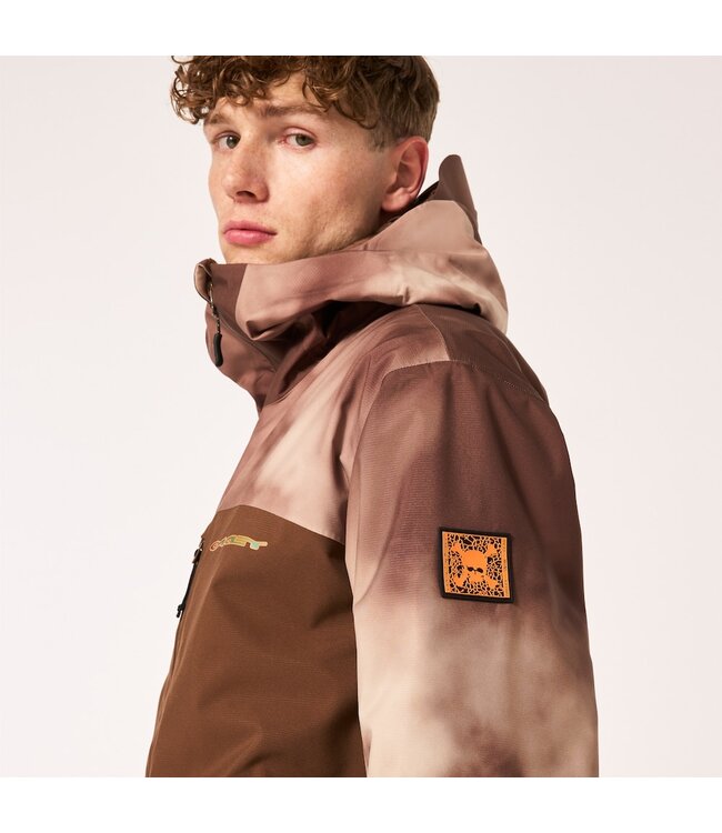 OAKLEY TC  SKULL REDUCT SHELL JACKET CARAFE/BROWN CLOUDS PRINT 2024