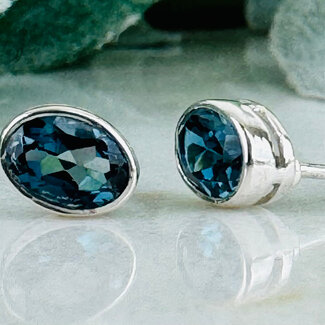 Blue Topaz (London) Earrings - Oval Faceted Studs - Bezel Set Sterling Silver