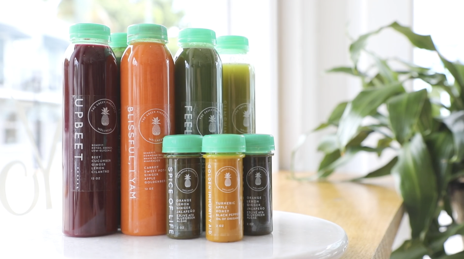 selection of green pineapple wellness juices