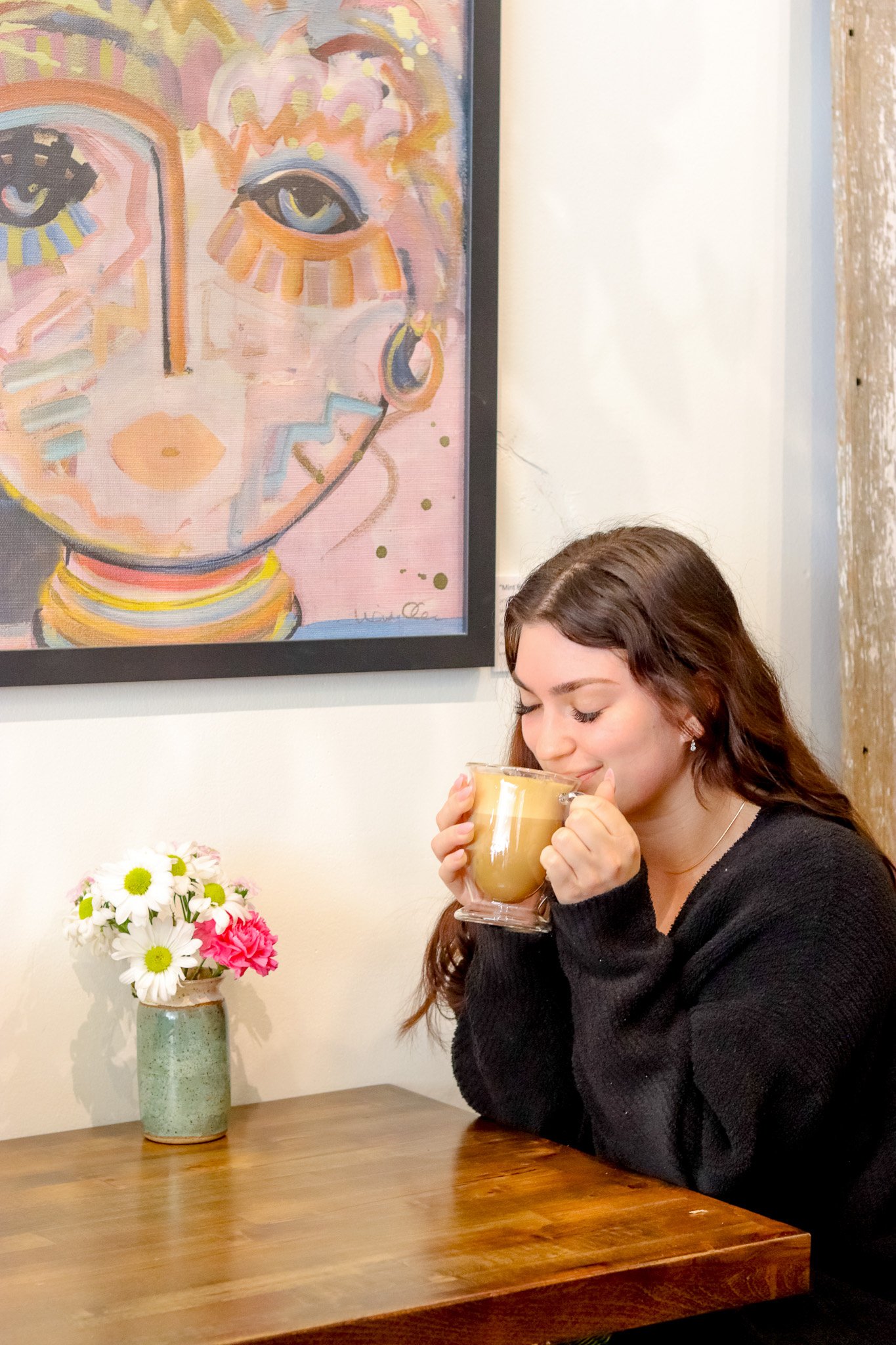 Woman drinking a latte