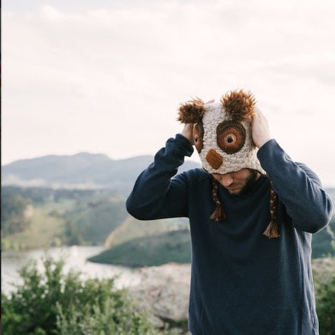 person with owl hat