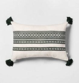 White throw pillows with green stitch & tassels