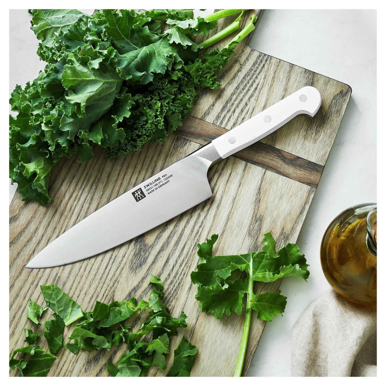 https://cdn.shoplightspeed.com/shops/633447/files/48401758/1500x4000x3/zwilling-ja-henckels-7-pro-chefs-knife-with-white.jpg