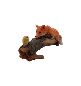 Playful Red Fox with Bird Figurine