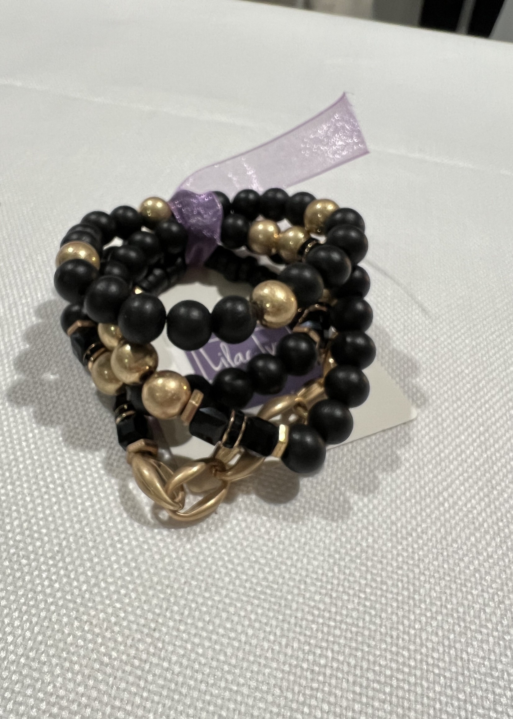 Black natural stone and gold 4 bracelet