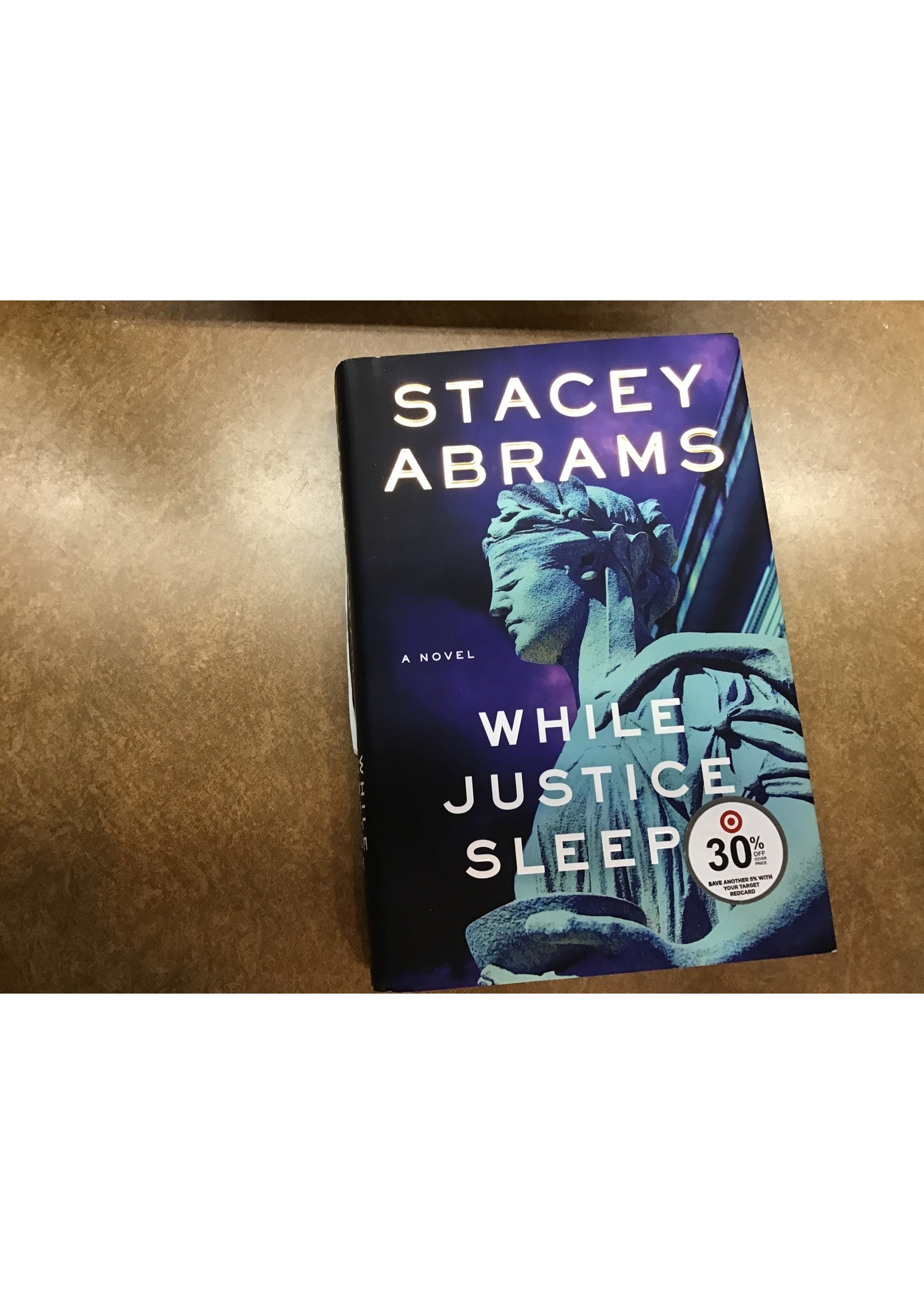 *cover ripped*While Justice Sleeps - by Stacey Abrams (Hardcover)