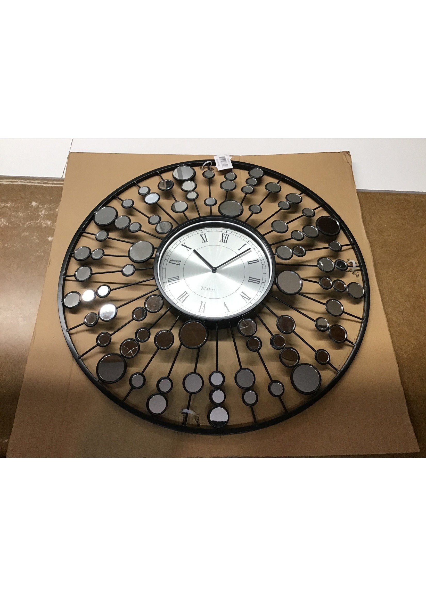 Broken reflectors- DecMode 26 Black Metal Starburst Radial Wall Clock with Mirrored Accents