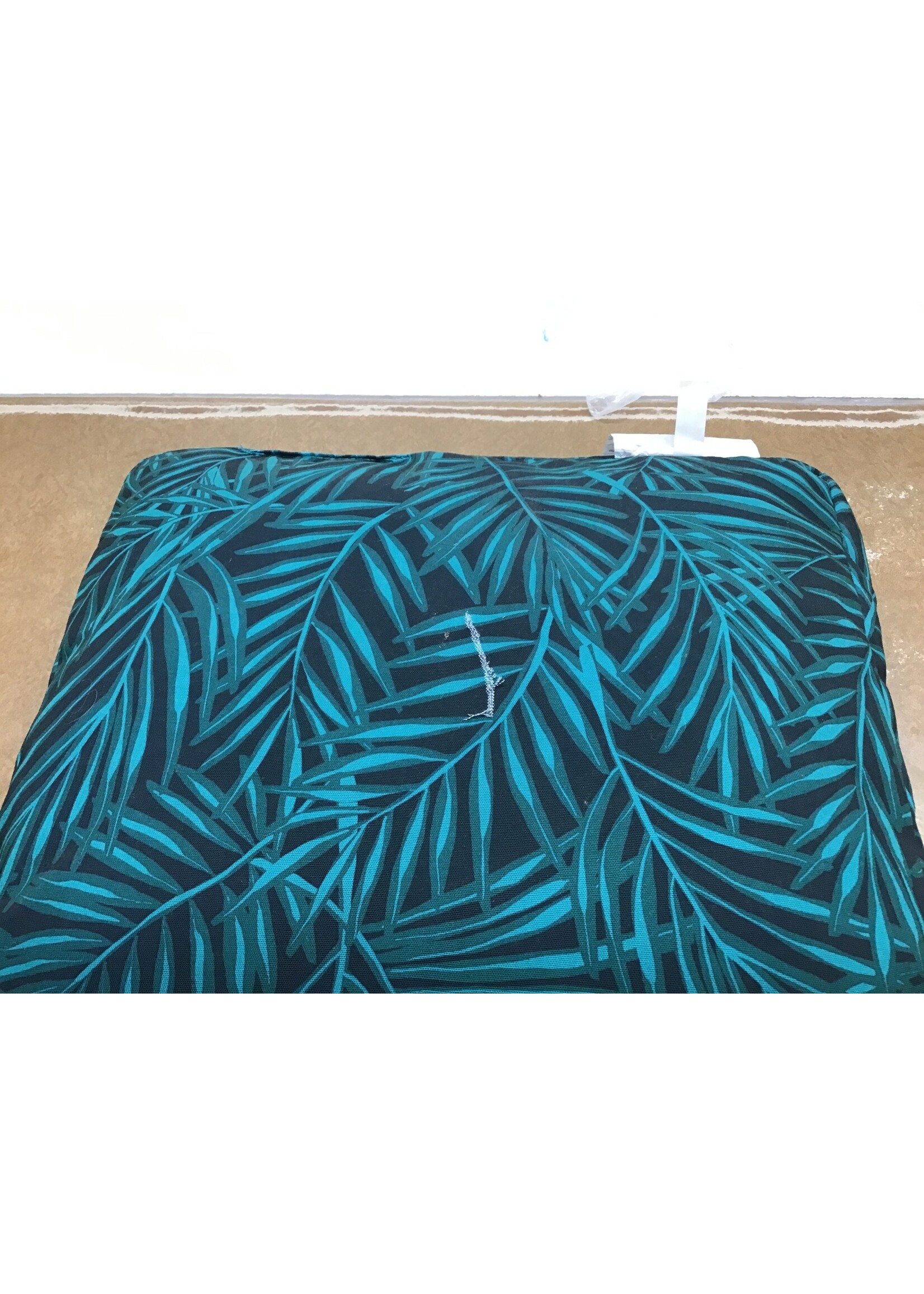 *rip in bottom* Decorative pillow sitting green leaves