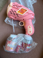 Used- Geometry Electric Bubble Gun- pink- batteries and one bottle of bubbles included