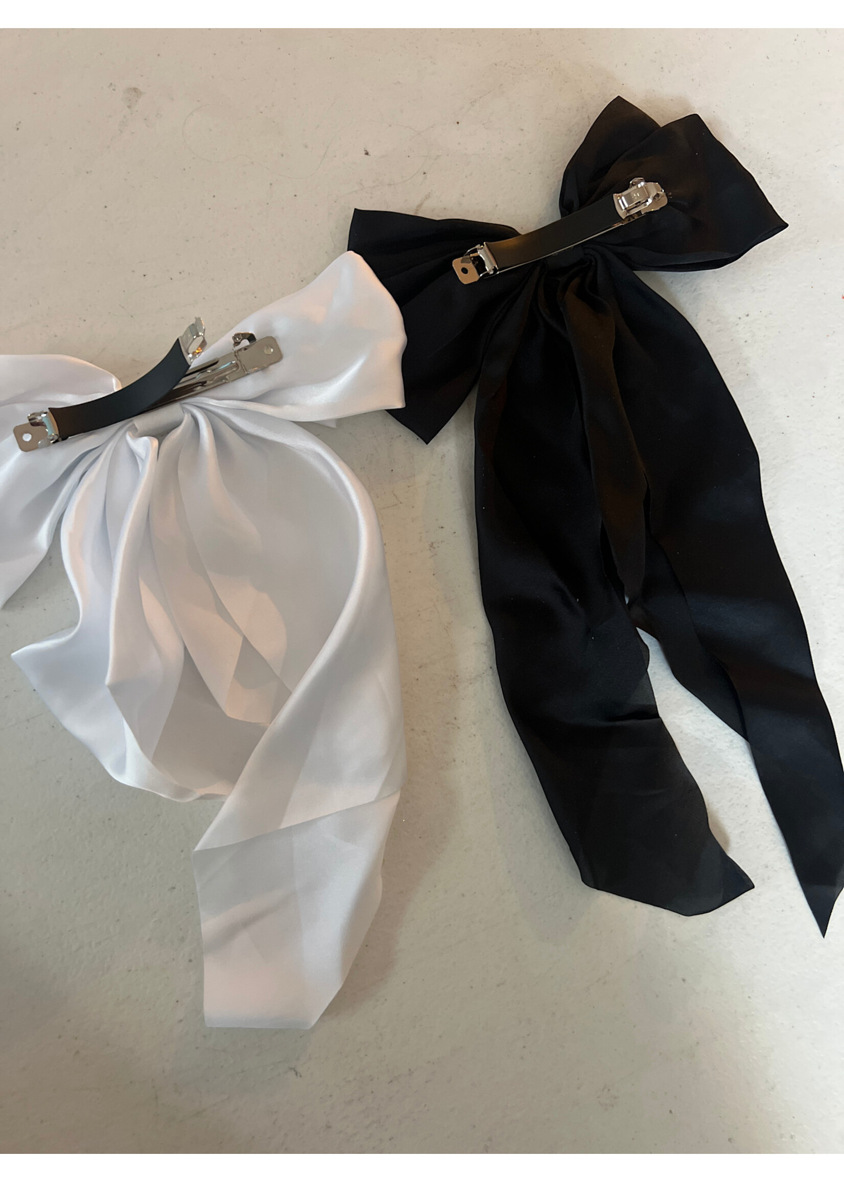 Two oversized bows NWOT black & white with clips
